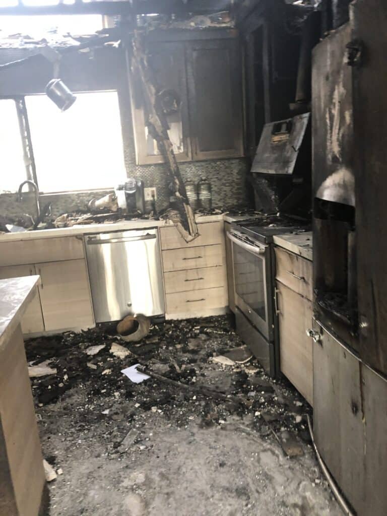 Fire-damaged kitchen requiring cleanup and restoration in Ventura